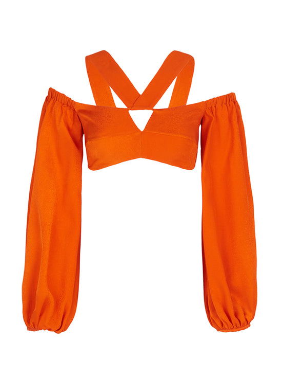 Carole Top Bright Orange off-the-shoulder crop top with billowing sleeves and a cross-body strap design, isolated on a white background.
